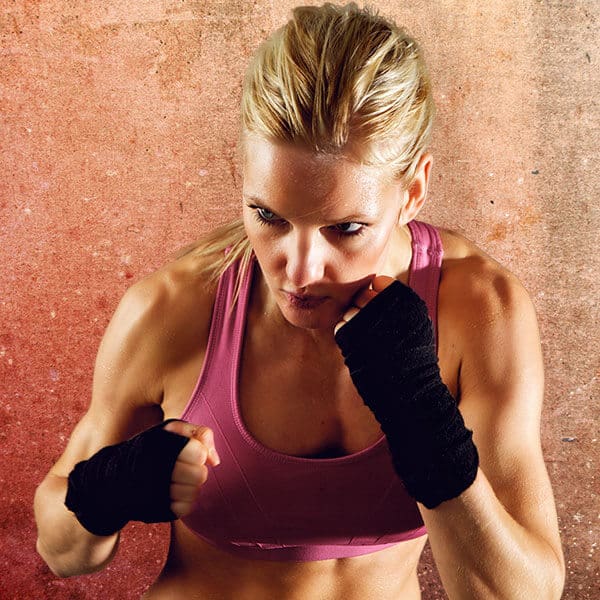 Mixed Martial Arts Lessons for Adults in Westerville OH - Lady Kickboxing Focused Background