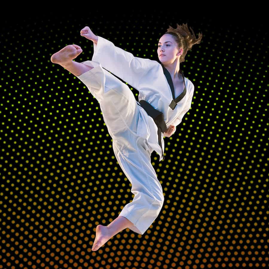 Martial Arts Lessons for Adults in Westerville OH - Girl Black Belt Jumping High Kick